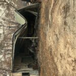 A destroyed outbuilding