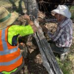 Helping Charlie repair one of his fences
